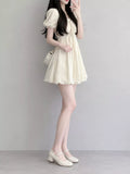 Puff-Sleeve Smocked Mini Dress with Tie-Front Detail