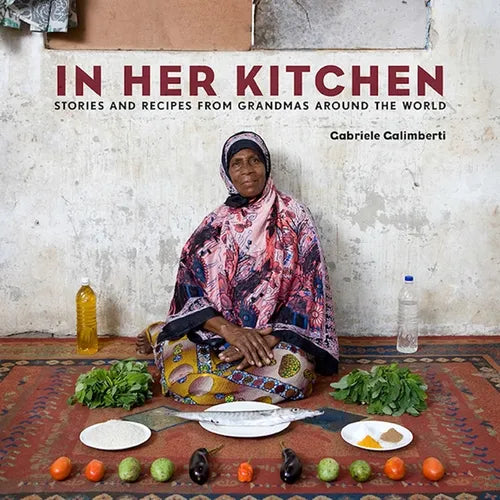 In Her Kitchen: Stories and Recipes from Grandmas Around the World: A Cookbook - Hardcover