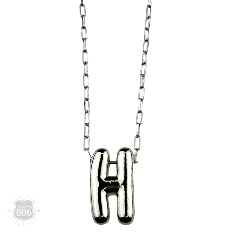 Silver letter pendant on necklace, initial monogram