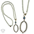 Long pearl bead necklace with shiny metal pendant with crystals from Swarovski®