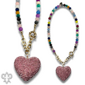 Rhinestone heart pendant on multi-color bead necklace