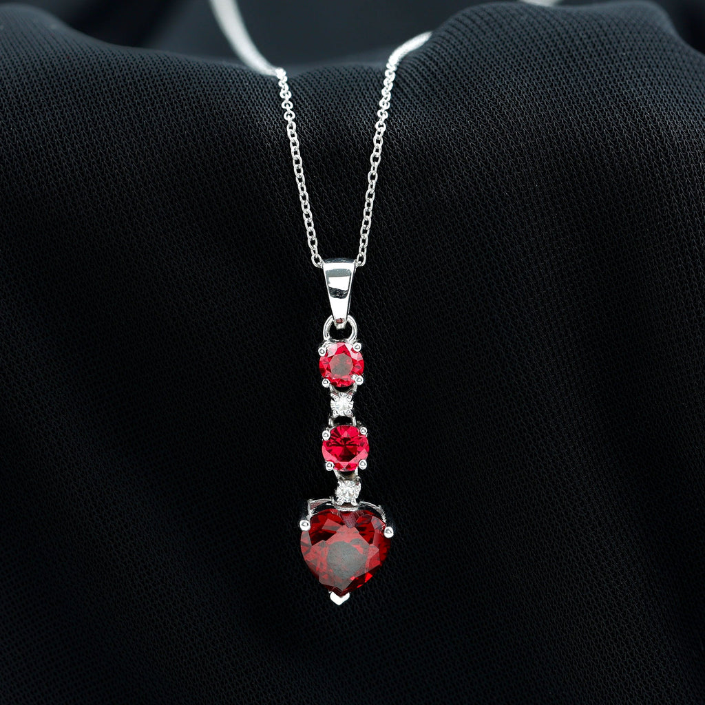Created Ruby and Moissanite Heart Dangle Pendant Necklace