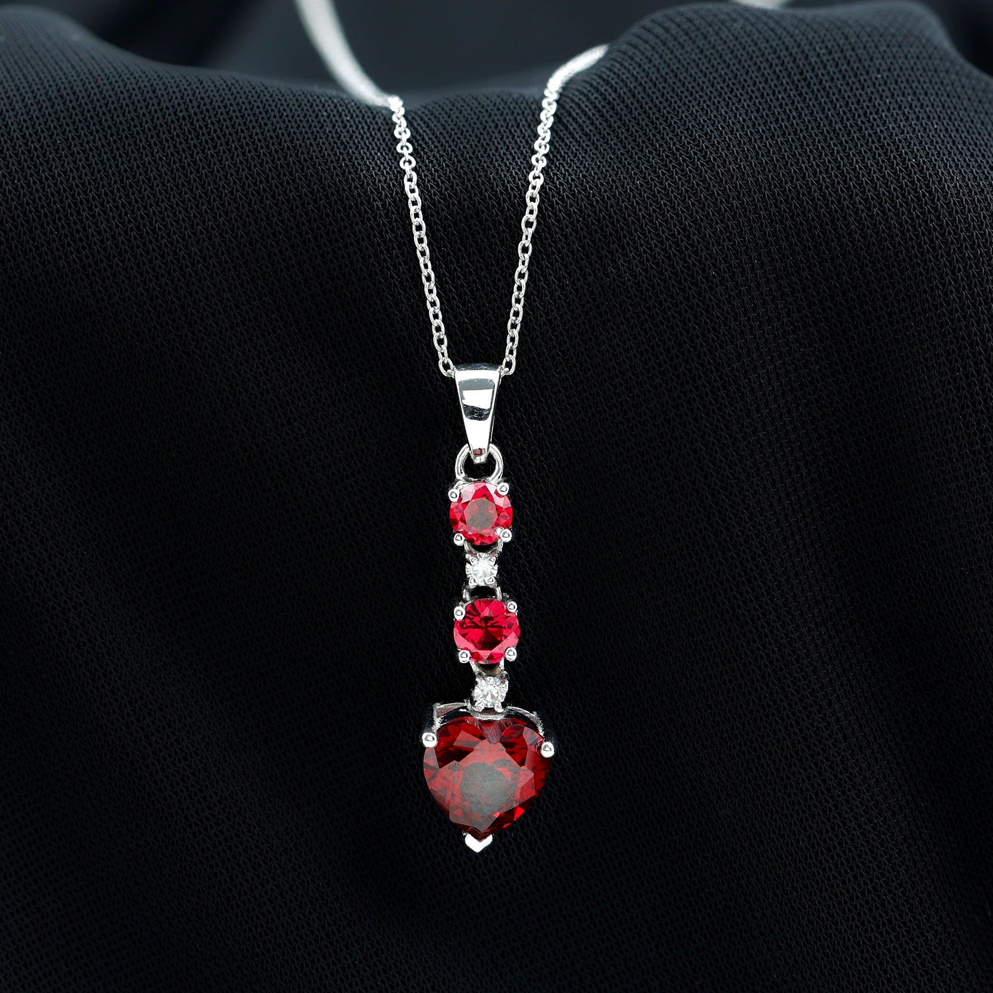 Created Ruby and Moissanite Heart Dangle Pendant Necklace