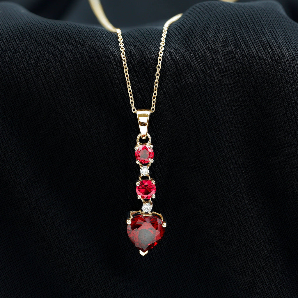 Created Ruby and Moissanite Heart Dangle Pendant Necklace