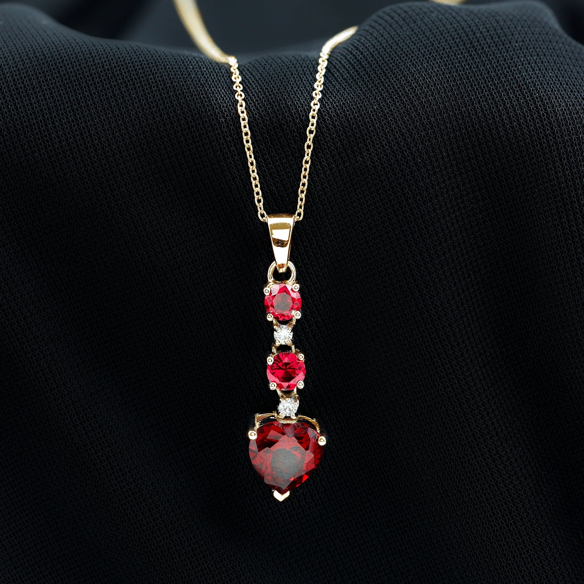 Created Ruby and Moissanite Heart Dangle Pendant Necklace