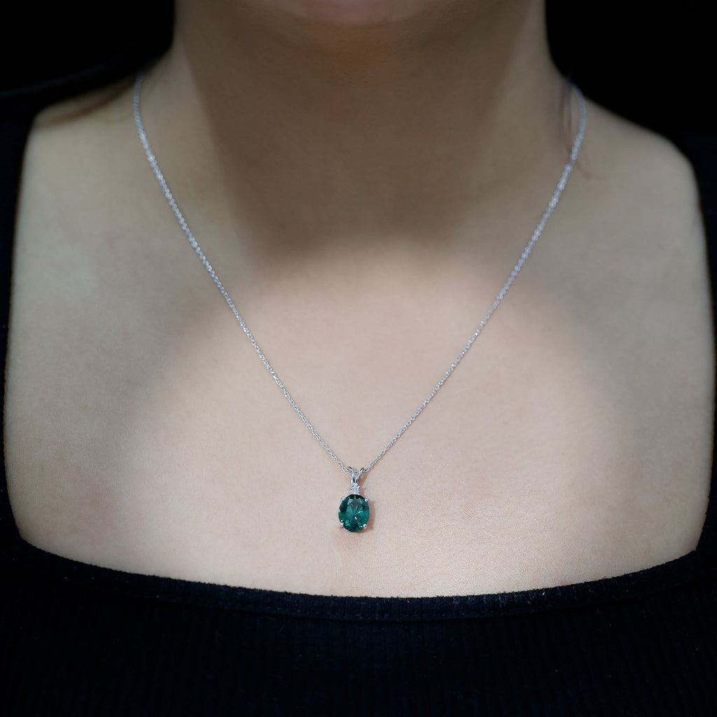Oval Created Emerald and Moissanite Solitaire Pendant