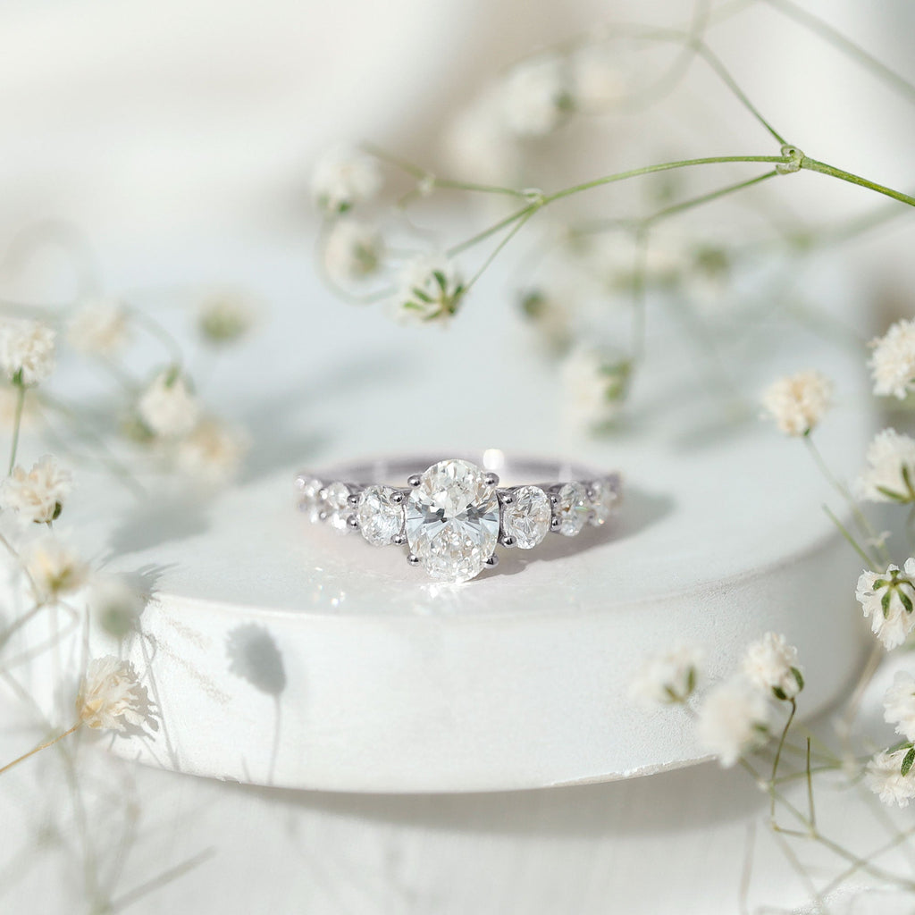 1.2 Carat Oval Cut Moissanite Side Stone Engagement Ring