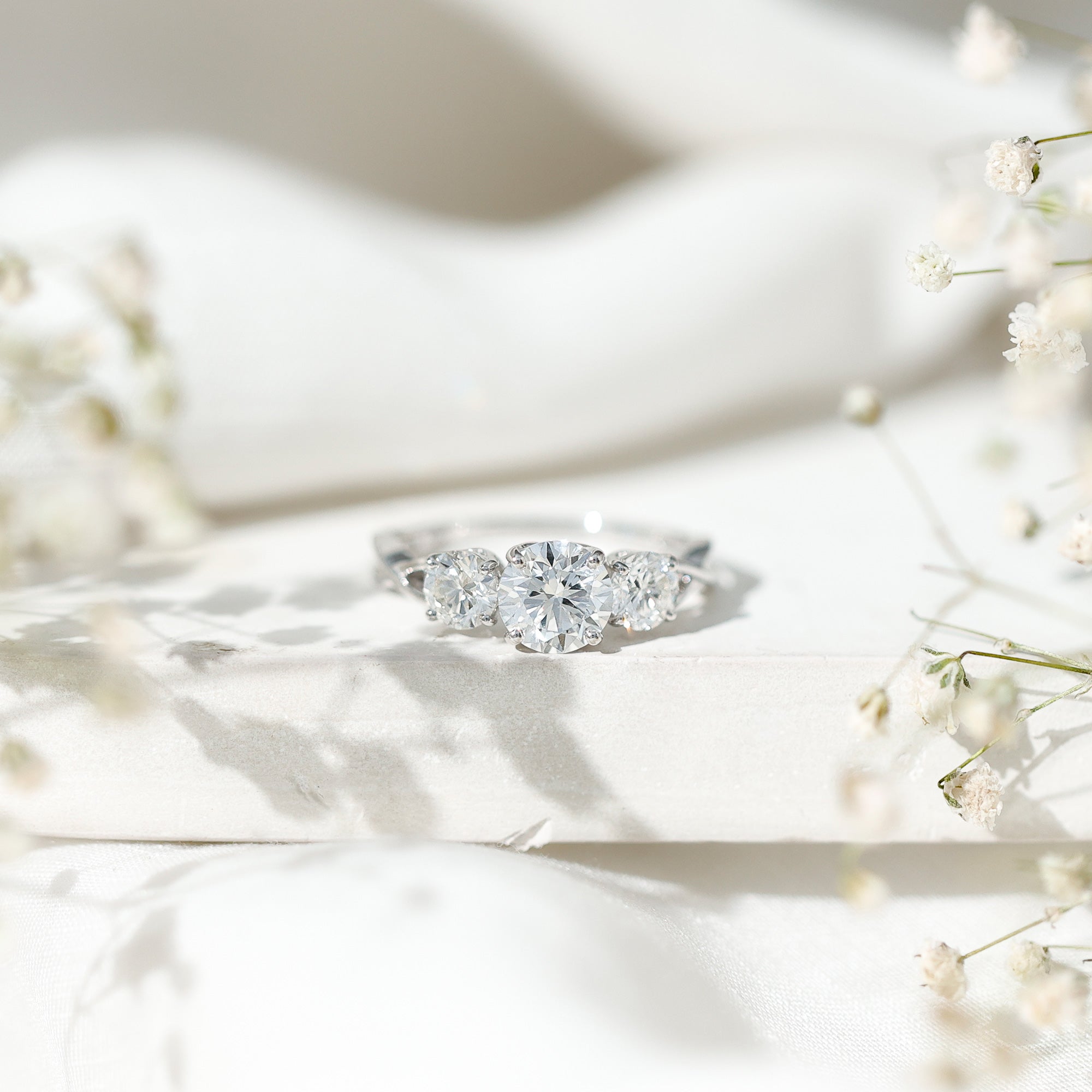 3 Stone Round Moissanite Crossover Engagement Ring