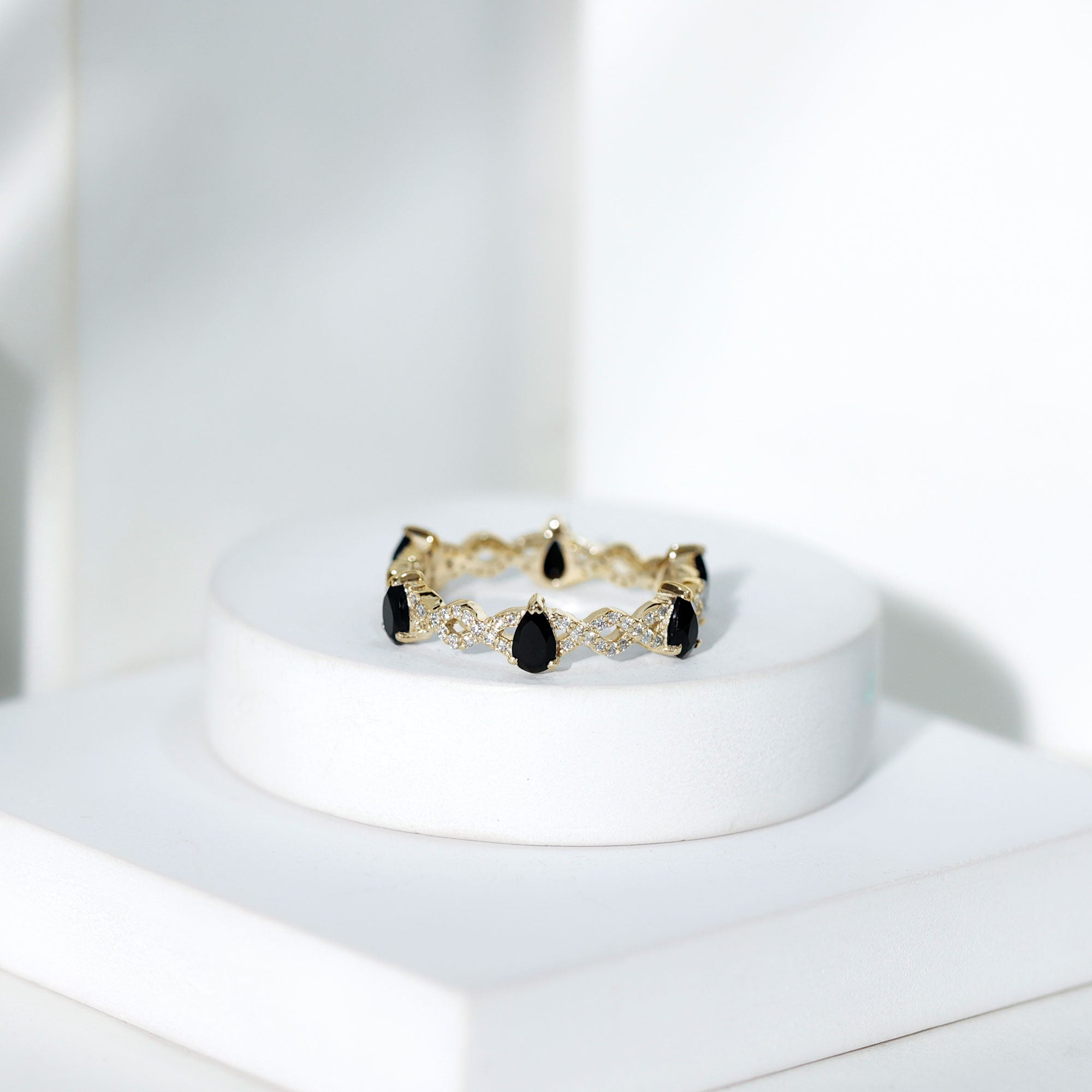 Pear Shaped Black Onyx and Diamond Crossover Wedding Band