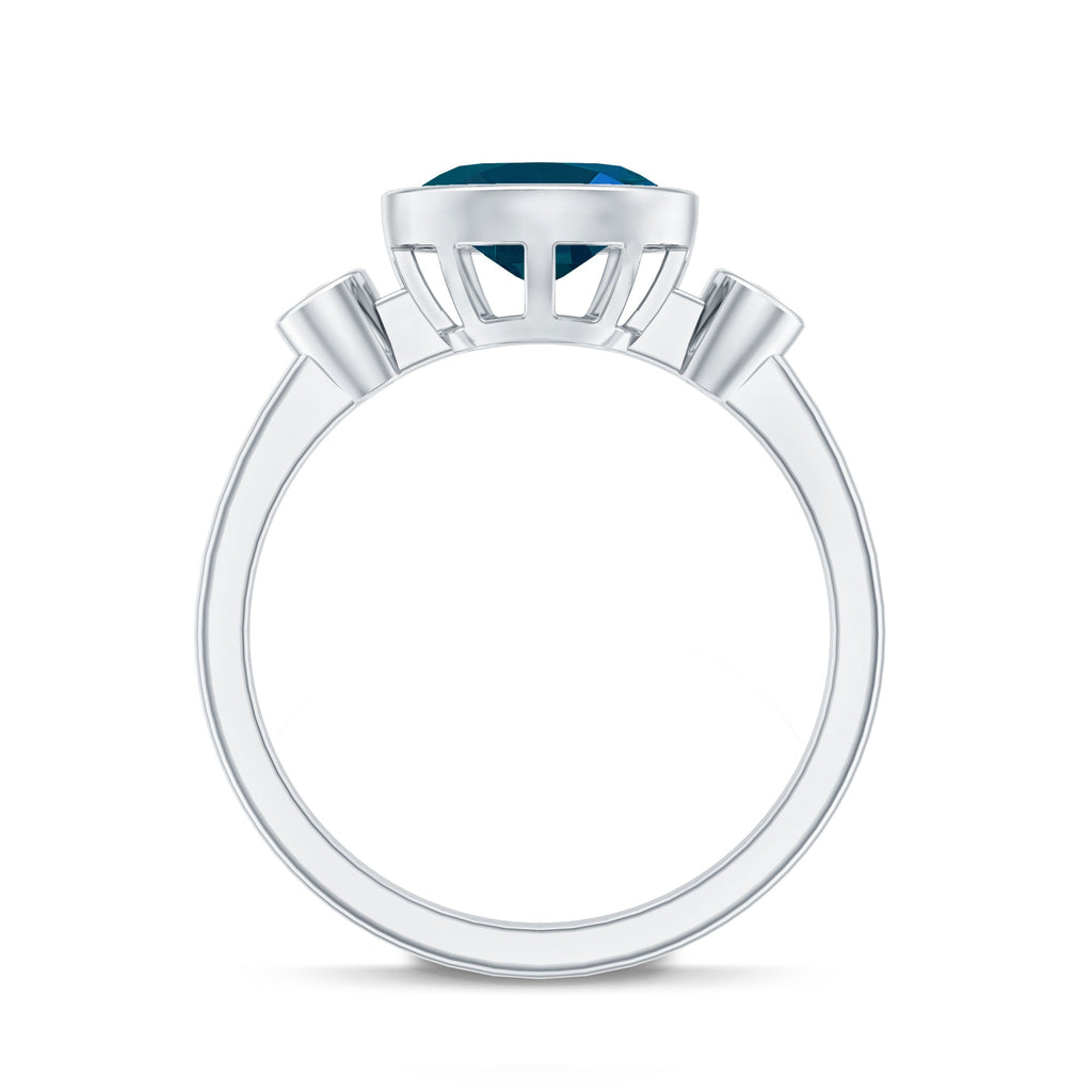 Oval London Blue Topaz Bezel Set Engagement Ring with Diamond