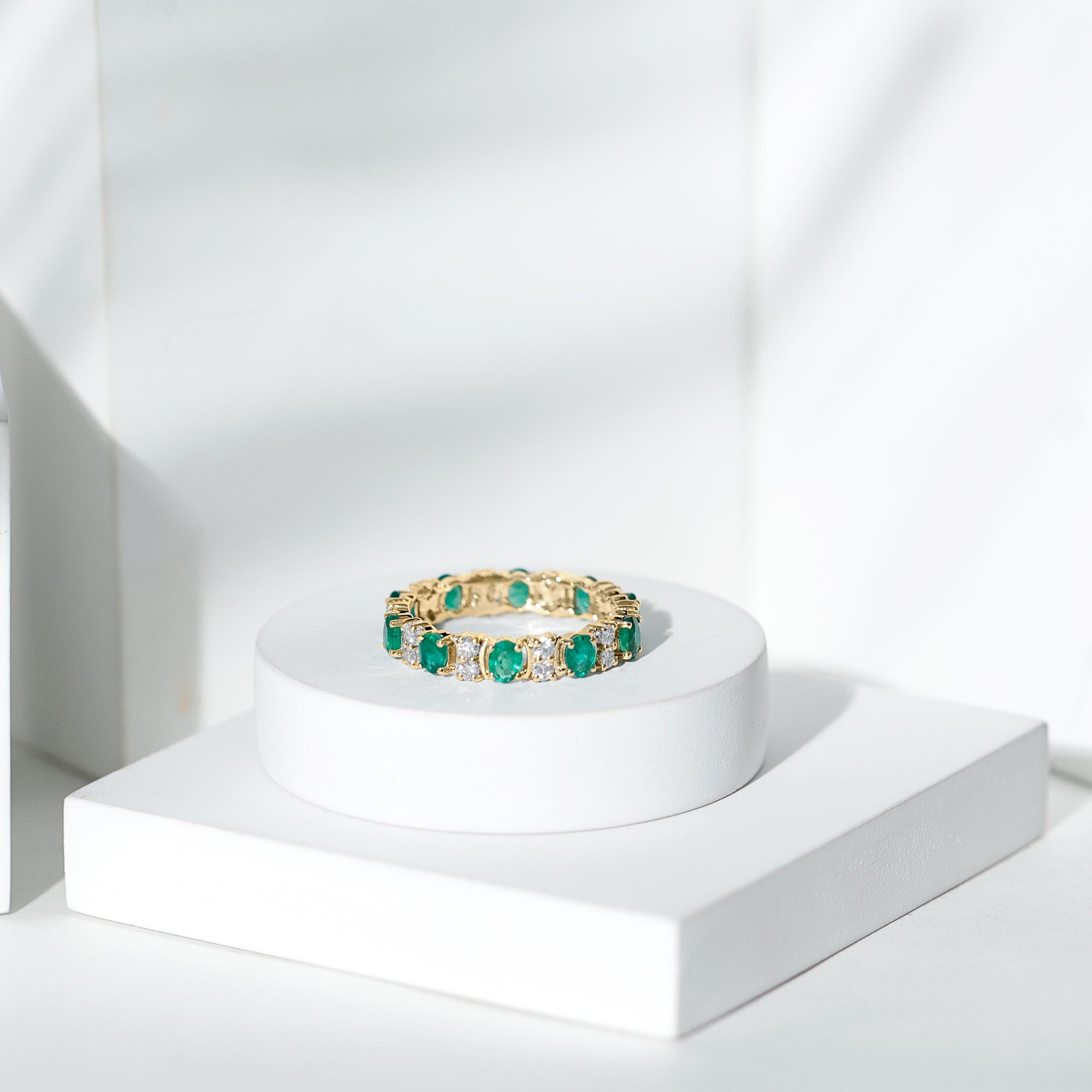Oval Emerald and Moissanite Eternity Wedding Band