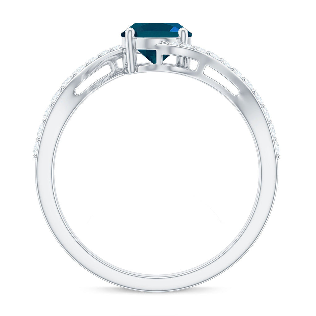 1 Carat Oval Cut London Blue Topaz and Diamond Bypass Engagement Ring