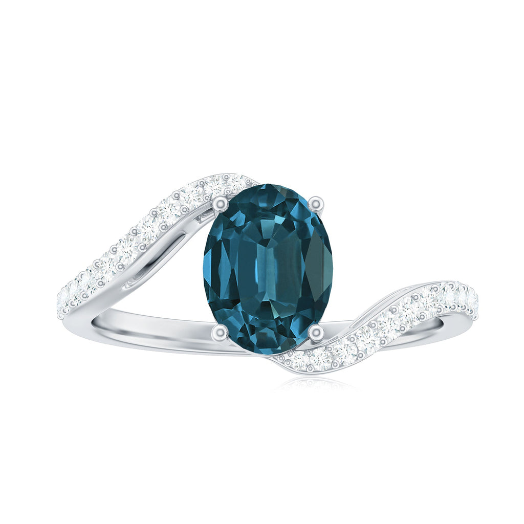 1 Carat Oval Cut London Blue Topaz and Diamond Bypass Engagement Ring