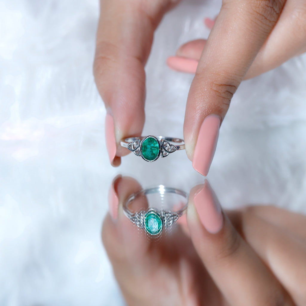 Oval Shaped Emerald Celtic Engagement Ring in Bezel Setting