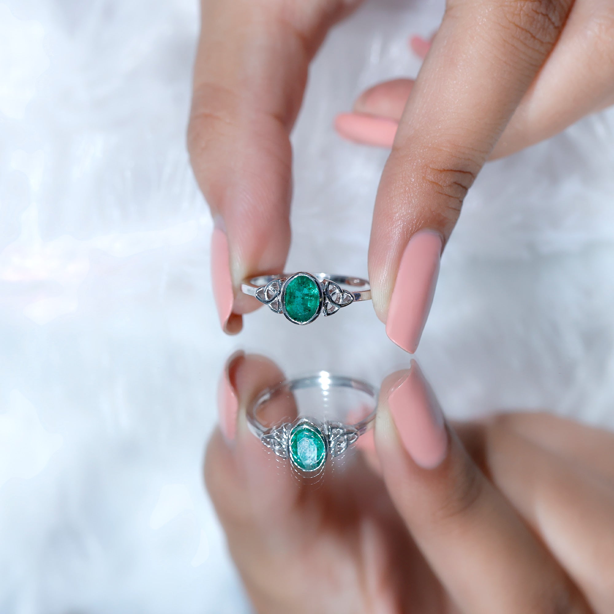 Oval Shaped Emerald Celtic Engagement Ring in Bezel Setting