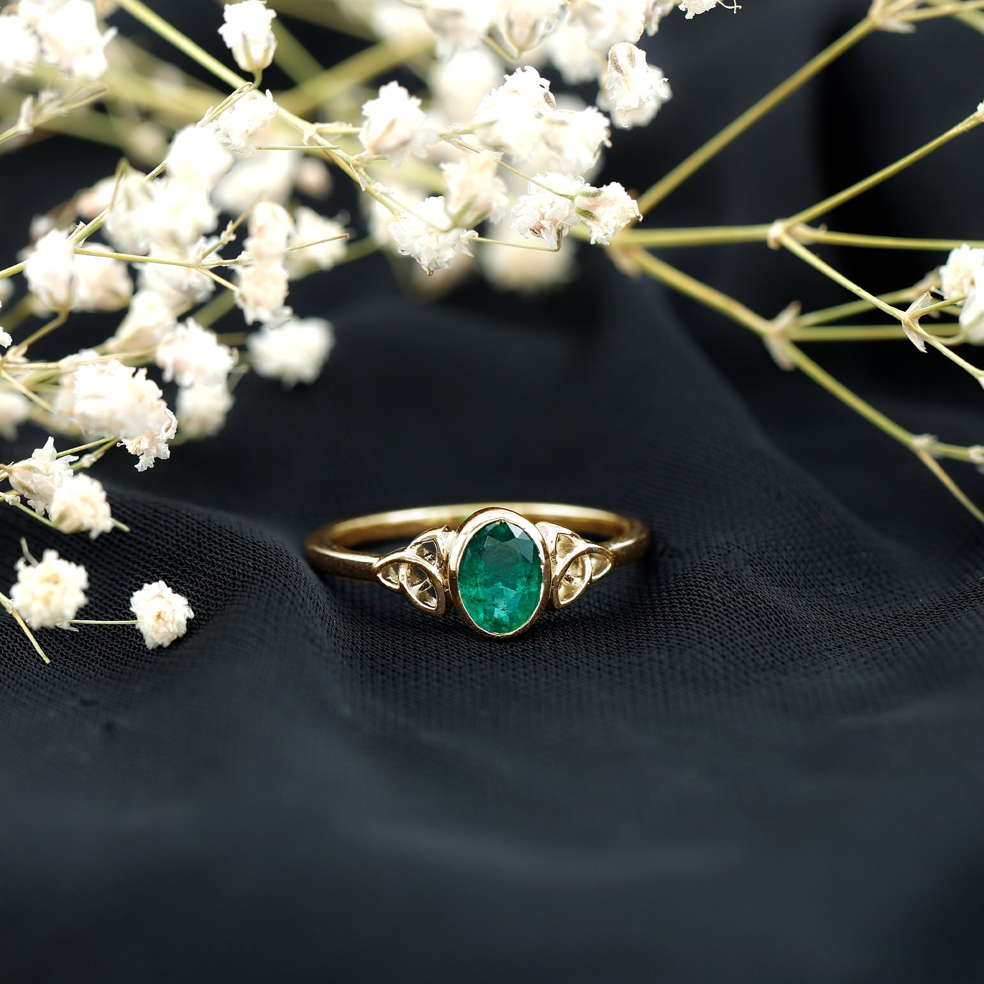 Oval Shaped Emerald Celtic Engagement Ring in Bezel Setting