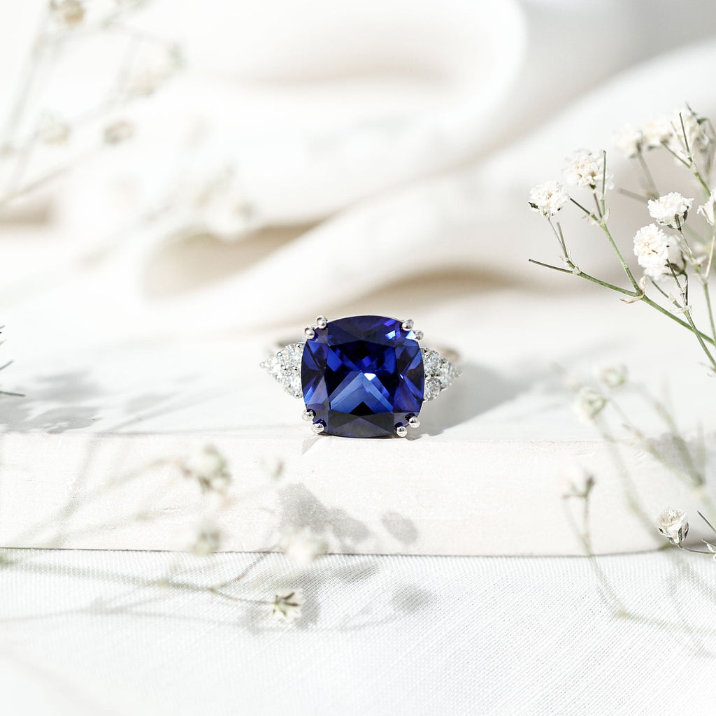Certified 9 Carat Lab Grown Blue Sapphire Cushion Cut Engagement Ring with Diamond Trio