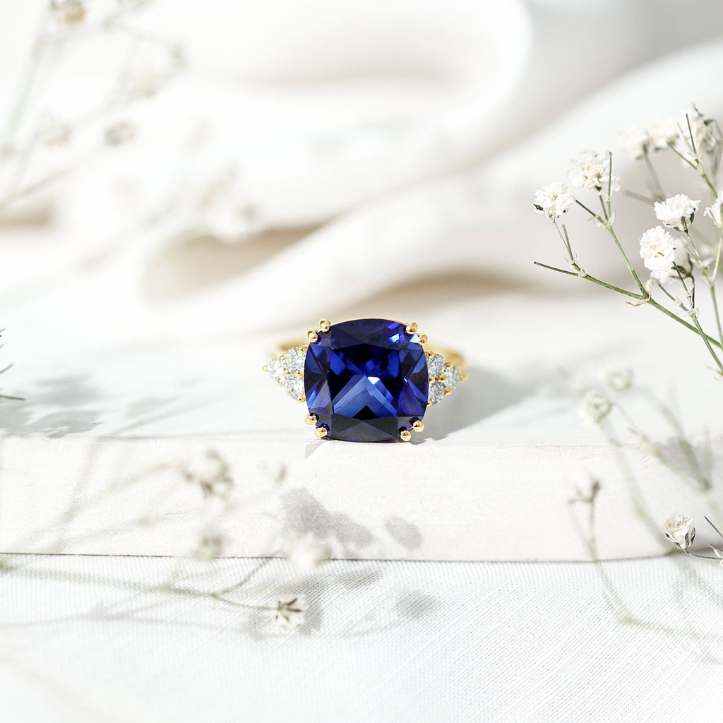 Certified 9 Carat Lab Grown Blue Sapphire Cushion Cut Engagement Ring with Diamond Trio