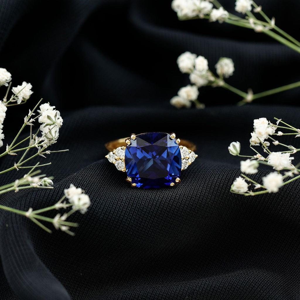Certified 9 Carat Lab Grown Blue Sapphire Cushion Cut Engagement Ring with Diamond Trio