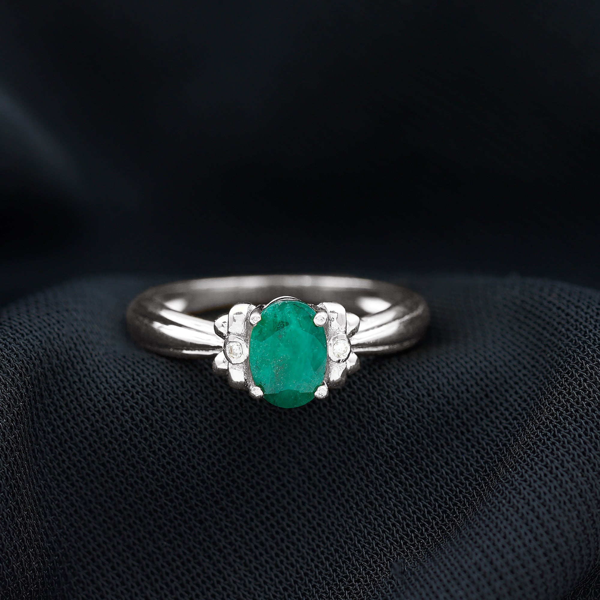 Oval Cut Emerald Solitaire Engagement Ring with Bow Design