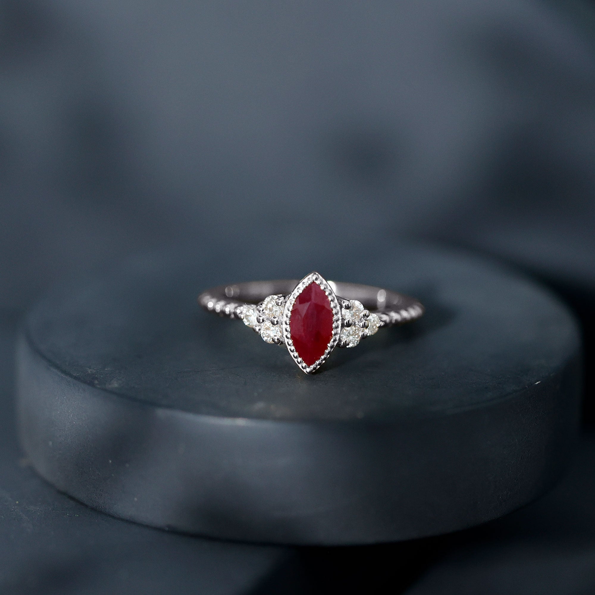 Vintage Style 0.75 Carat Ruby Marquise Engagement Ring with Diamond Trio