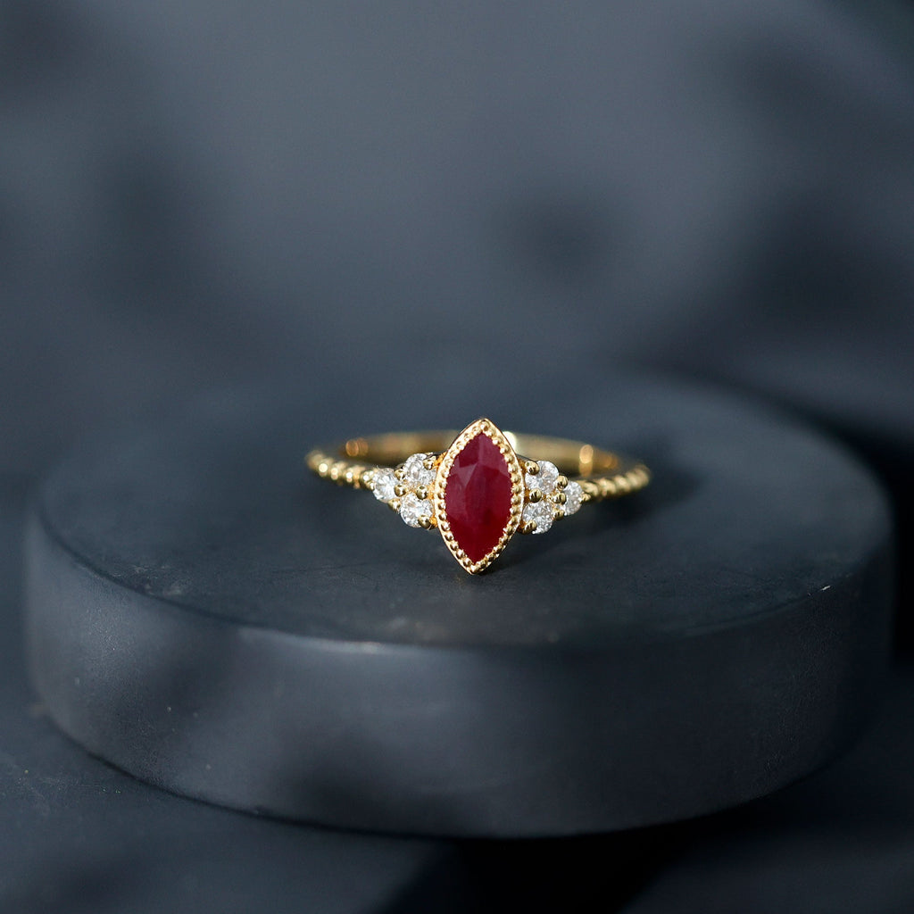 Vintage Style 0.75 Carat Ruby Marquise Engagement Ring with Diamond Trio