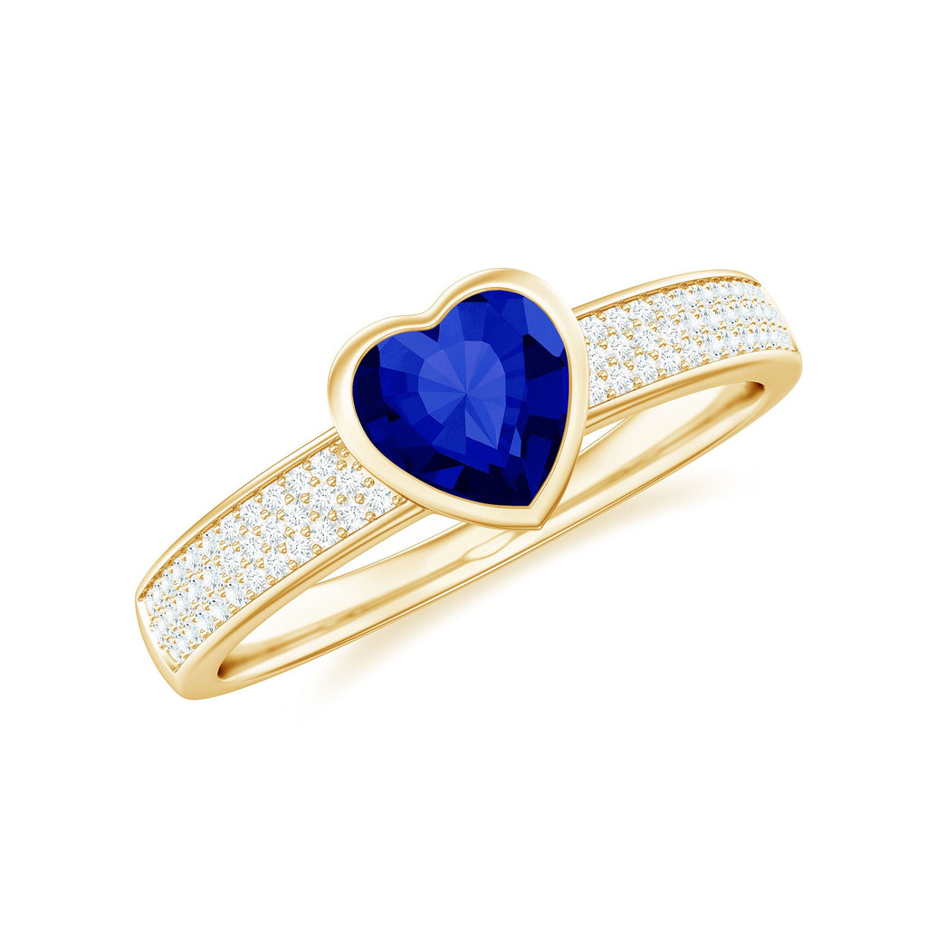Heart Shape Created Blue Sapphire Solitaire Ring with Diamond Side Stone