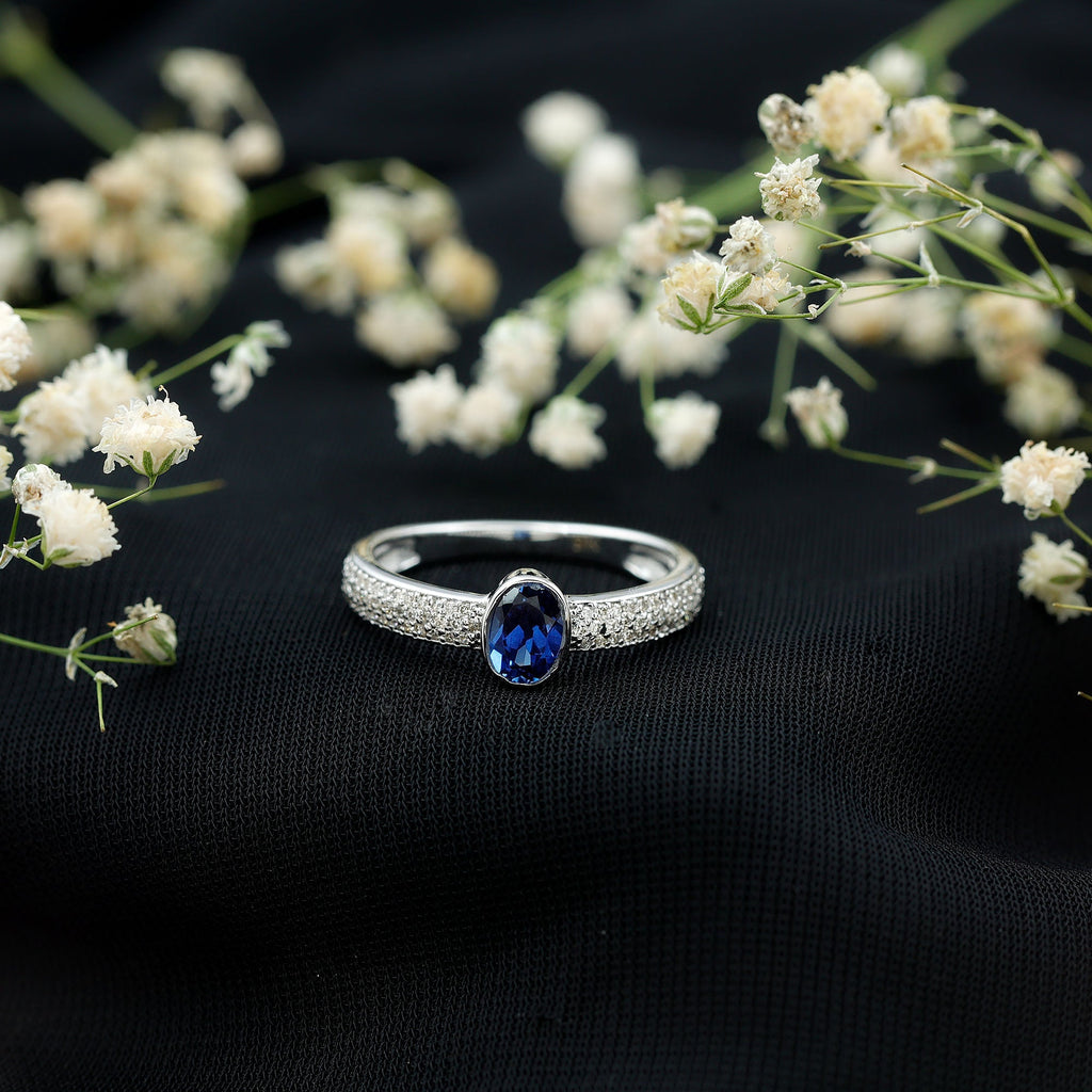 Certified 0.6 Carat Oval Lab Grown Blue Sapphire Engagement Ring with Diamond
