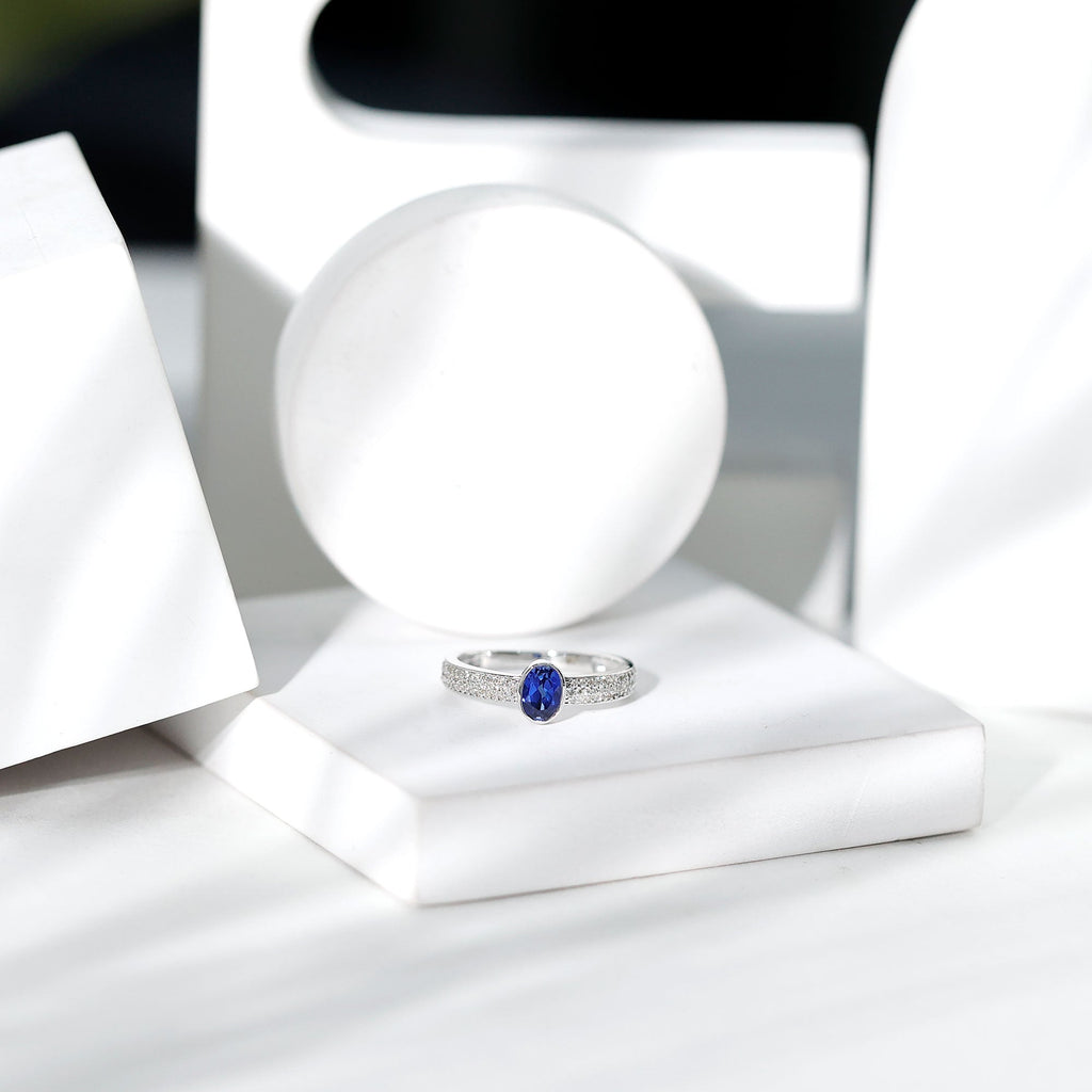 Certified 0.6 Carat Oval Lab Grown Blue Sapphire Engagement Ring with Diamond