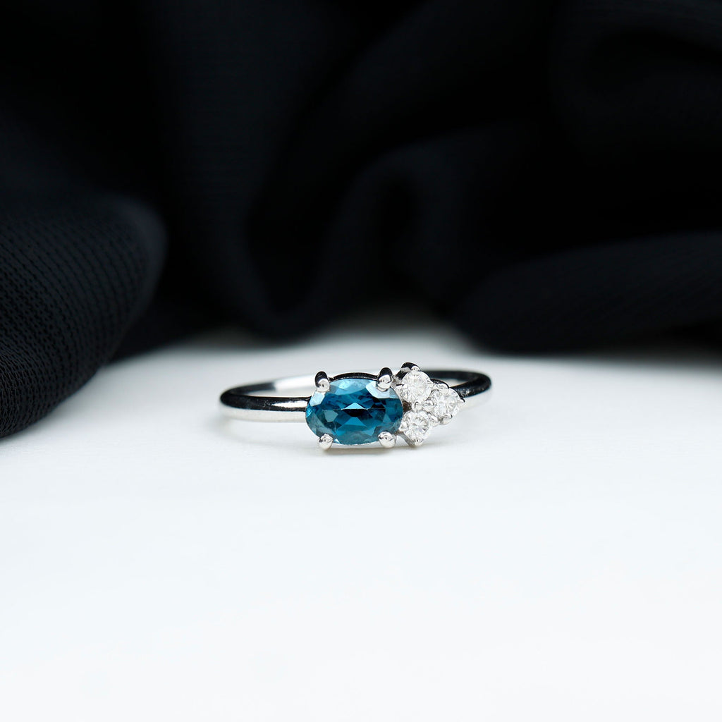 0.4 Carat Oval Cut London Blue Topaz East West Promise Ring with Diamond Trio
