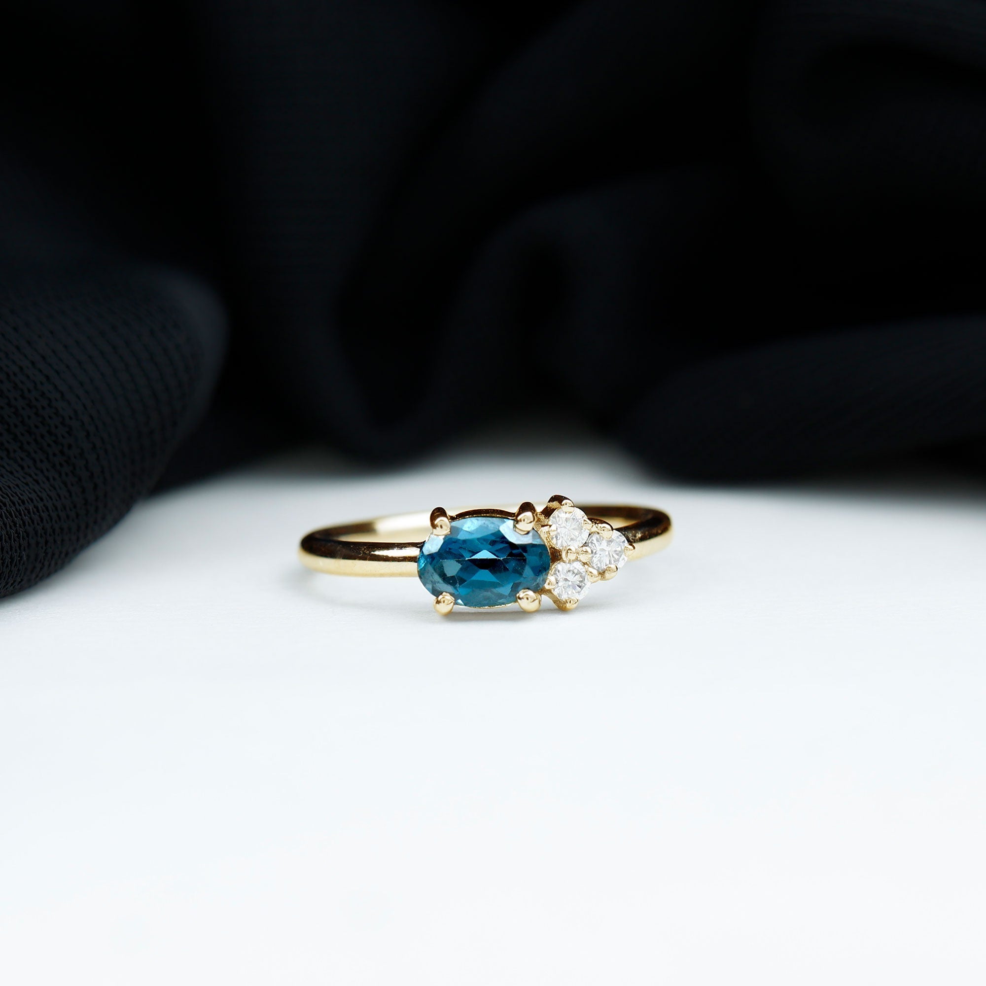 0.4 Carat Oval Cut London Blue Topaz East West Promise Ring with Diamond Trio