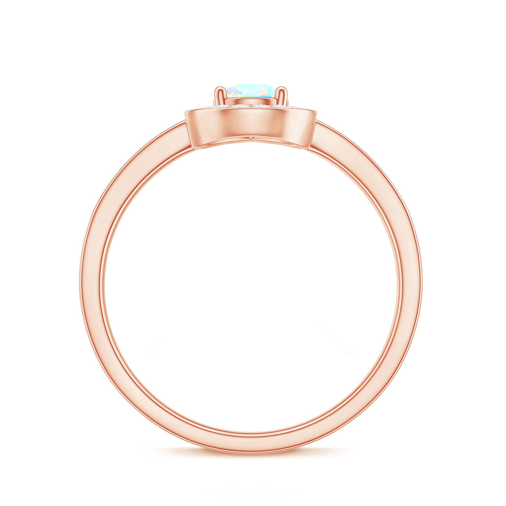 Natural 0.7 Carat Opalescent Teardrop Engagement Ring with Diamond Halo