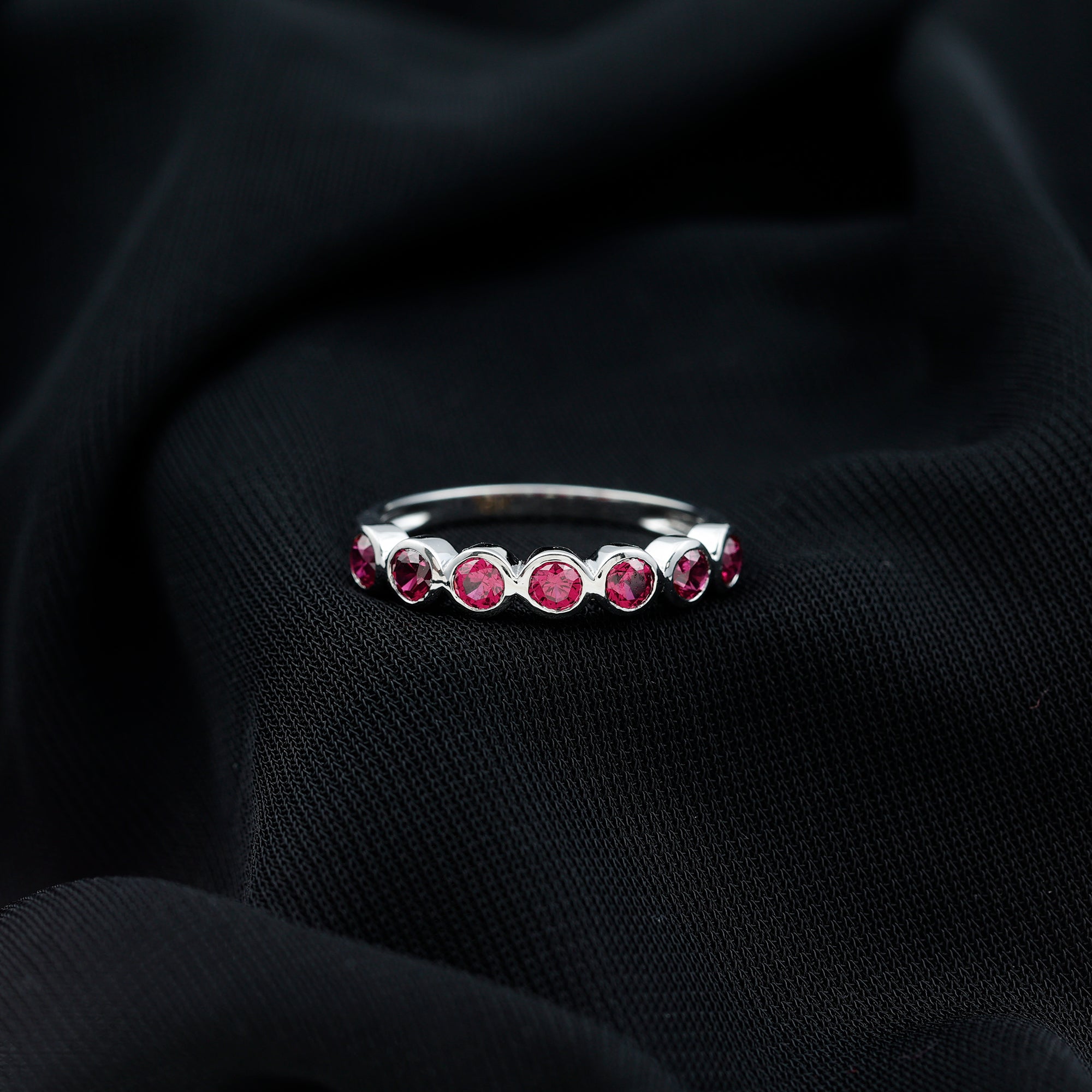 Minimal Created Ruby Half Eternity Ring in Bezel Setting