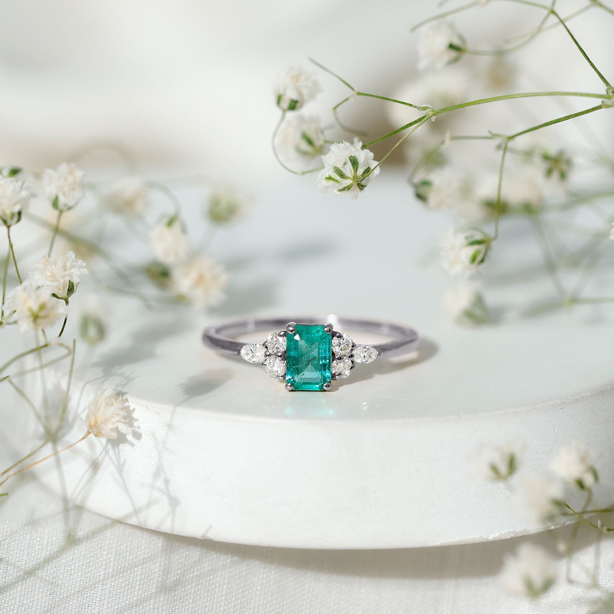 Emerald Cut Emerald Engagement Ring with Diamond Trio