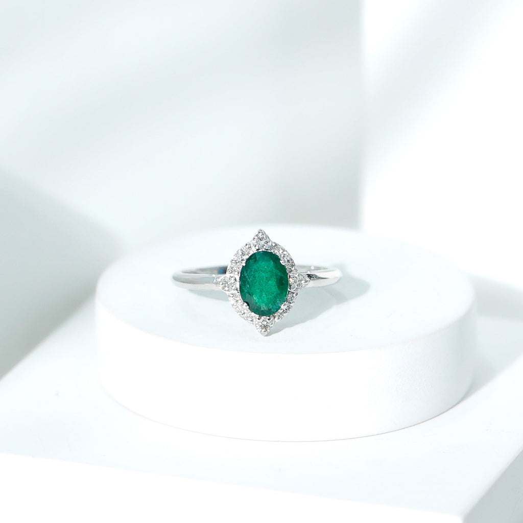 Vintage Looking Emerald Oval Engagement Ring with Diamond Halo
