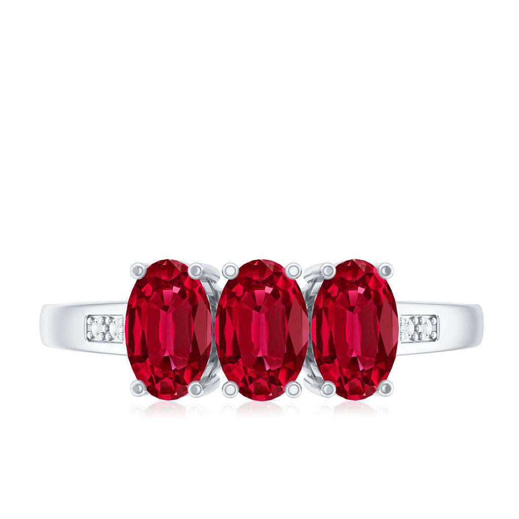 Oval Cut Lab Created Ruby Three Stone Engagement Ring