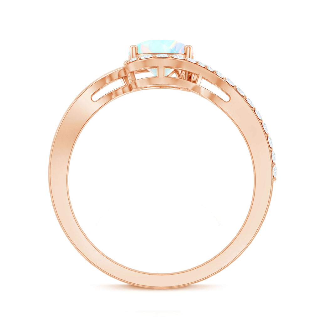 0.7 Carat Pear Cut Ethiopian Opal Engagement Ring with Diamond