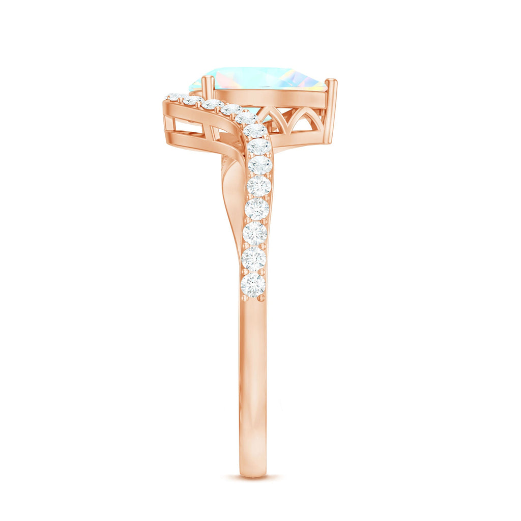 0.7 Carat Pear Cut Ethiopian Opal Engagement Ring with Diamond