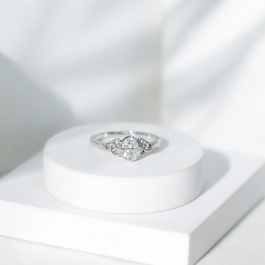 Oval Moissanite Solitaire Celtic Knot Ring in Bezel Setting
