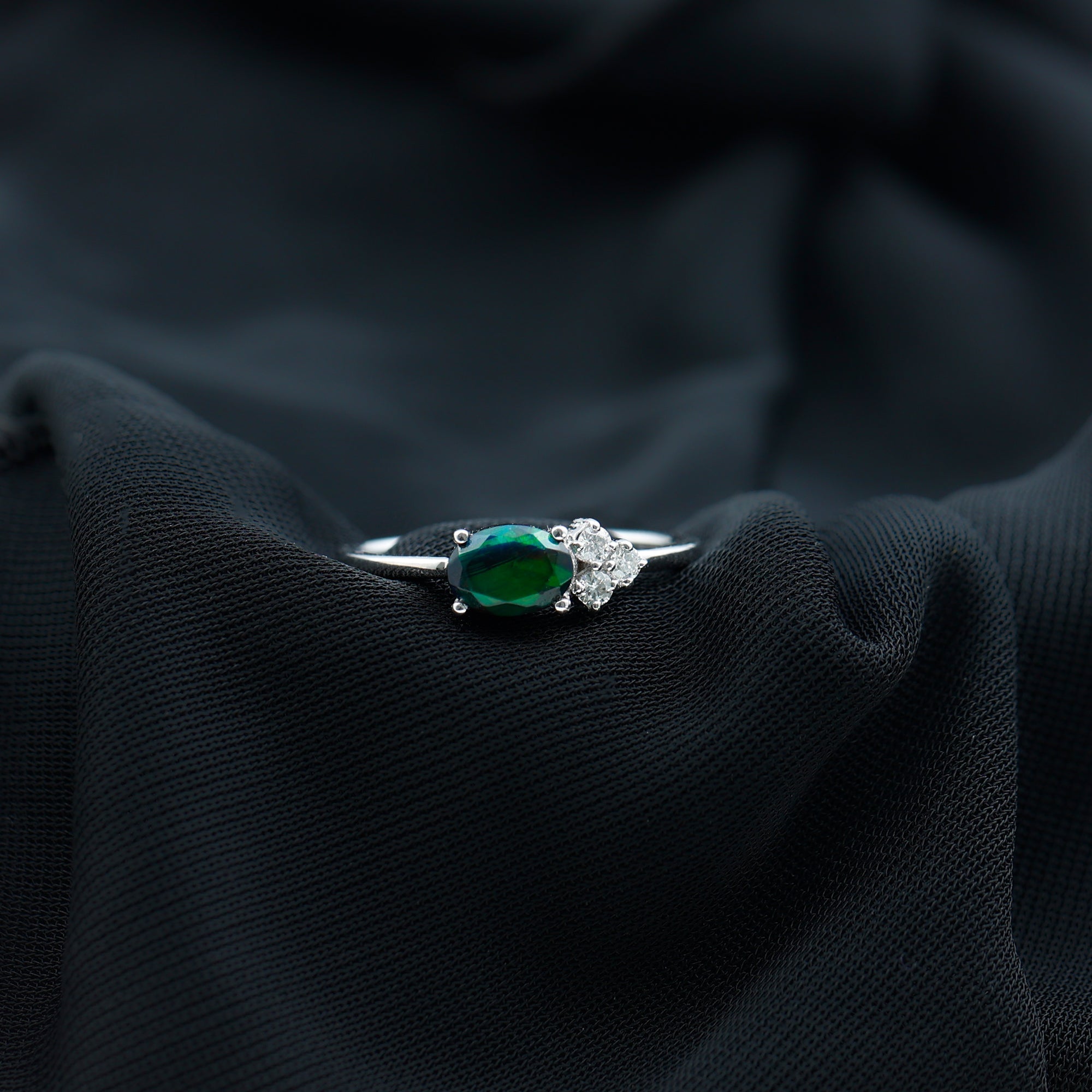 Oval Black Opal East West Ring with Diamond Trio