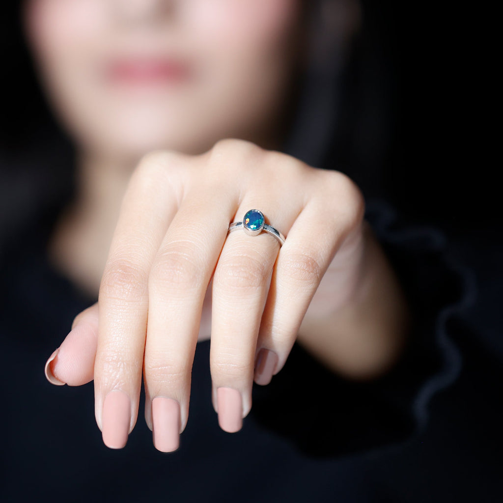 Oval Cut 0.9 Carat Black Opal Bezel Set Engagement Ring