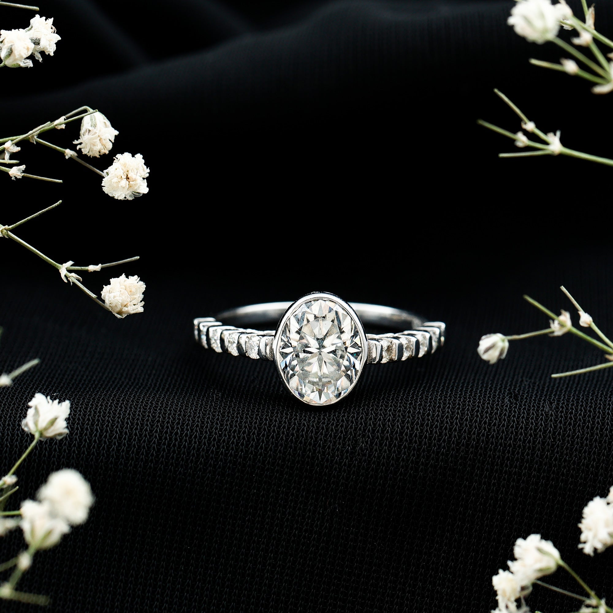 Bezel Set Moissanite Oval Engagement Ring with Side Stones