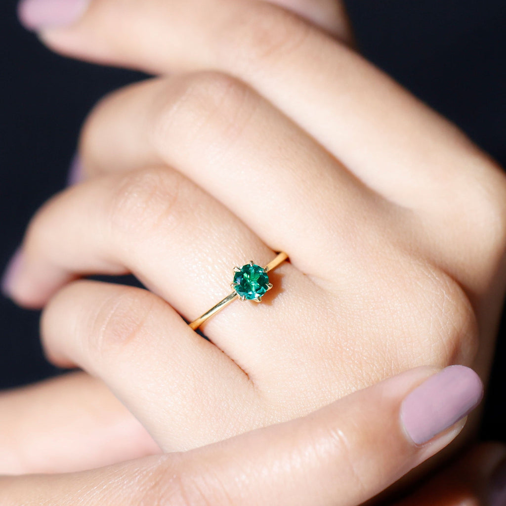 0.8 Carat Round Lab Grown Emerald Solitaire Ring in Lotus Basket Setting