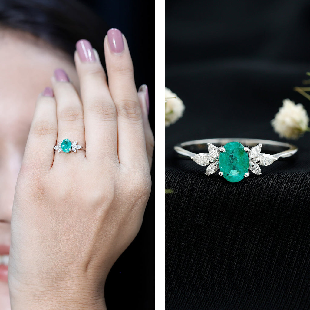 Oval Shaped Emerald Engagement Ring with Marquise Diamond Trio