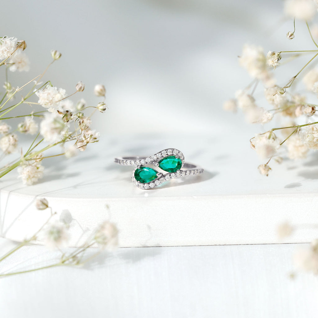 Pear Shape Created Emerald and Diamond Bypass Engagement Ring