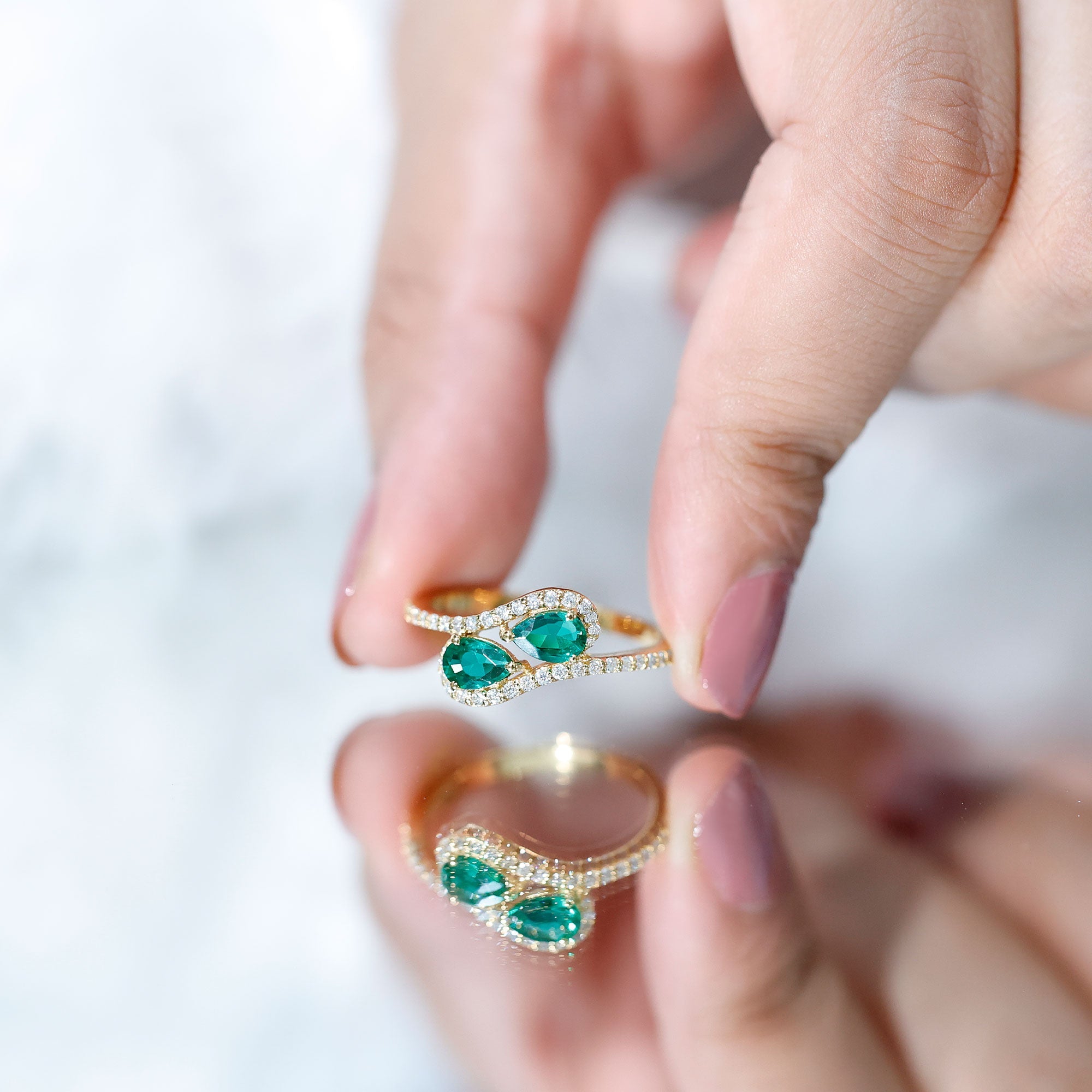 Pear Shape Created Emerald and Diamond Bypass Engagement Ring
