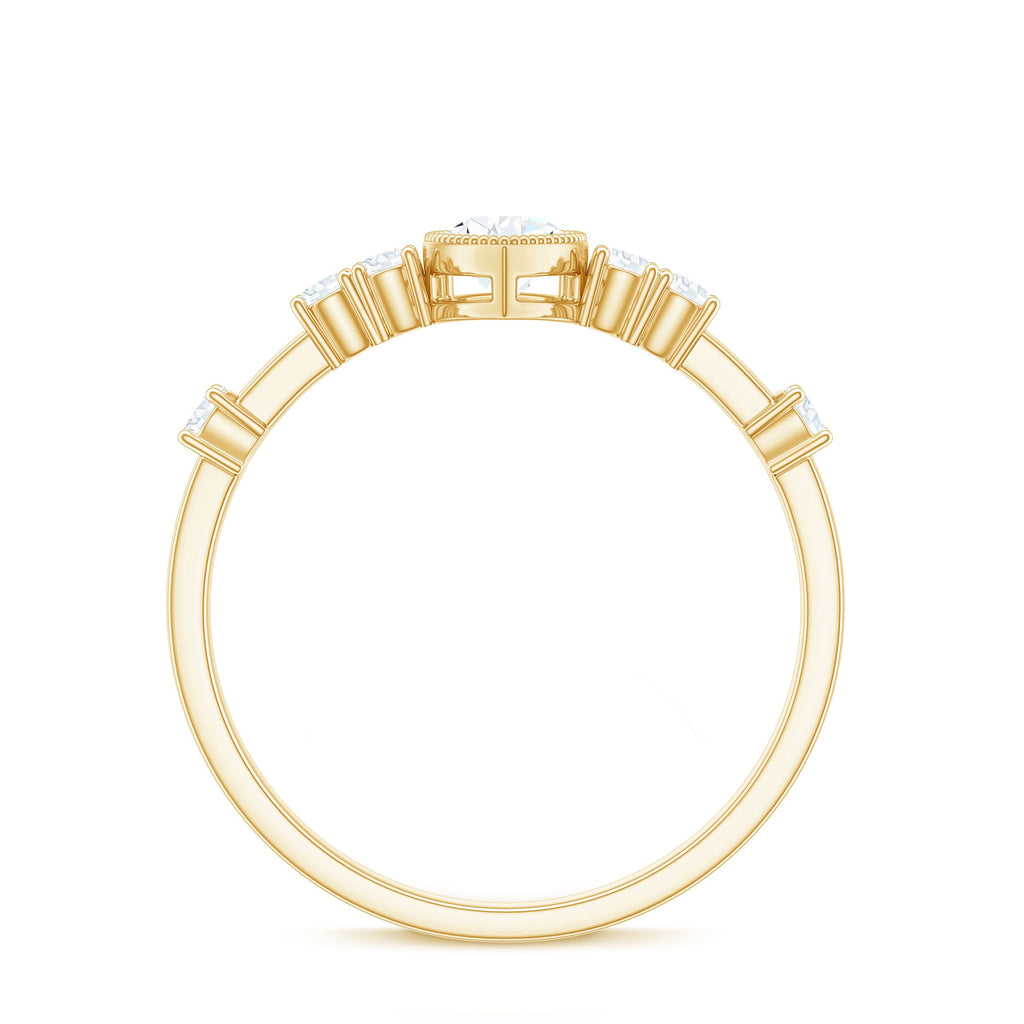 0.7 Carat Pear Cut Moissanite Solitaire Engagement Ring with Beaded Details