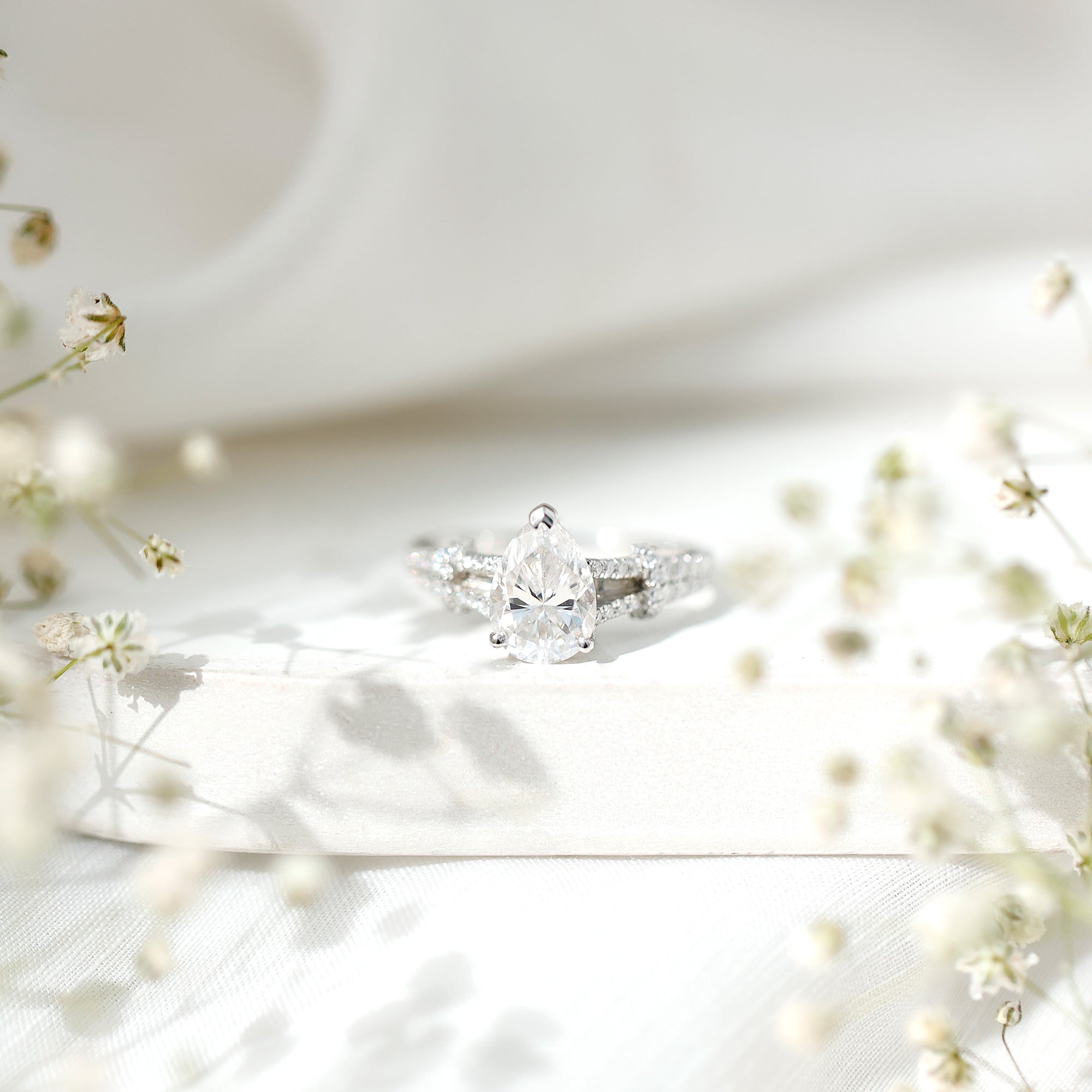Pear Shaped Moissanite Solitaire Engagement Ring in Split Shank