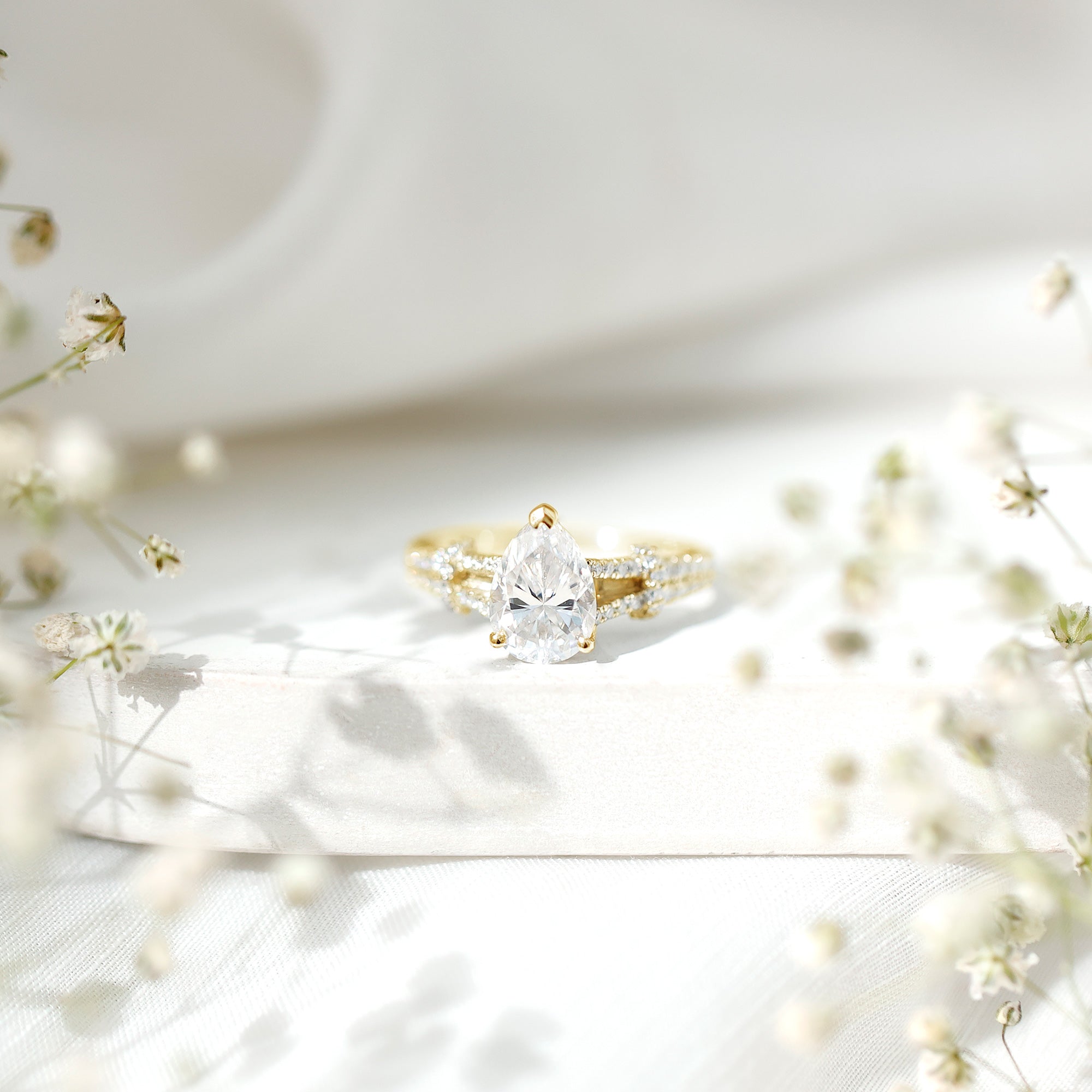 Pear Shaped Moissanite Solitaire Engagement Ring in Split Shank