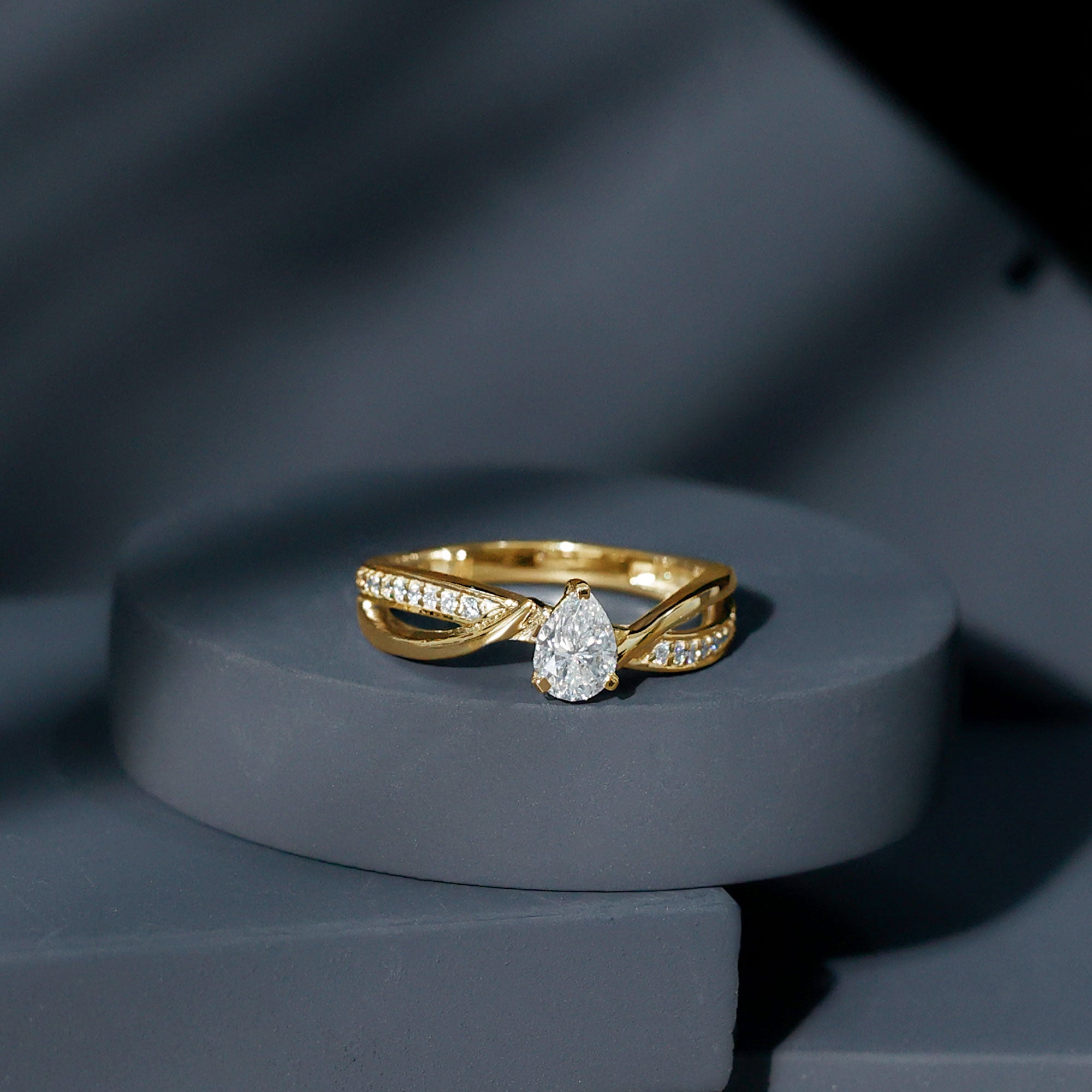 Pear Shaped Moissanite Infinity Engagement Ring